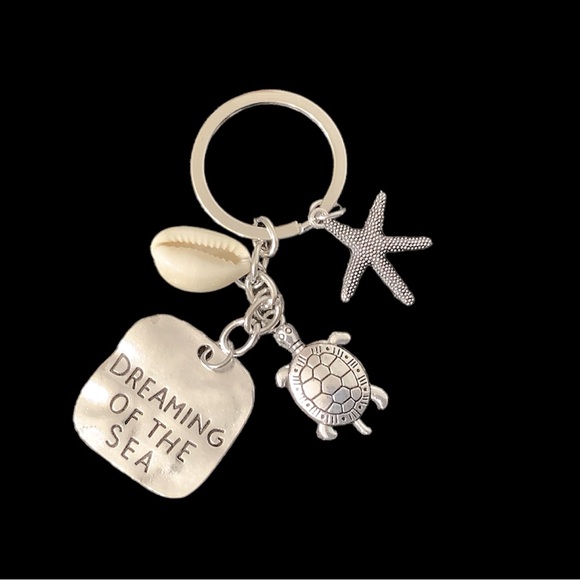 Silver Beachy keychain. Starfish, shell, and turtle charms. NWT. - Picture 3 of 4